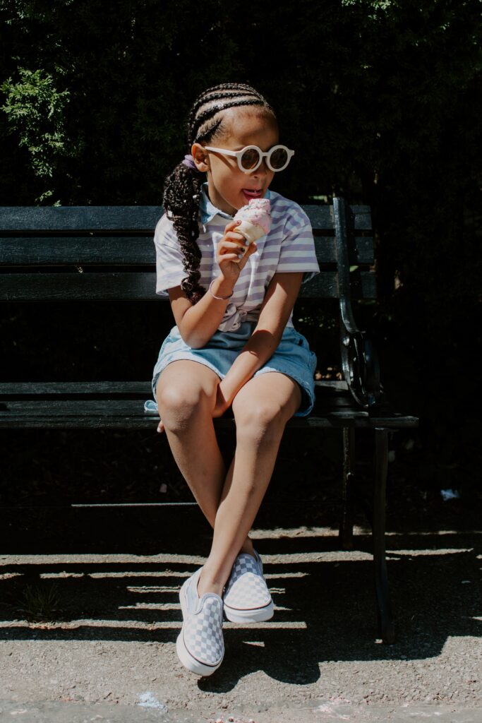 A girl with sunglasses eating ice cream (Growth mindset post)
