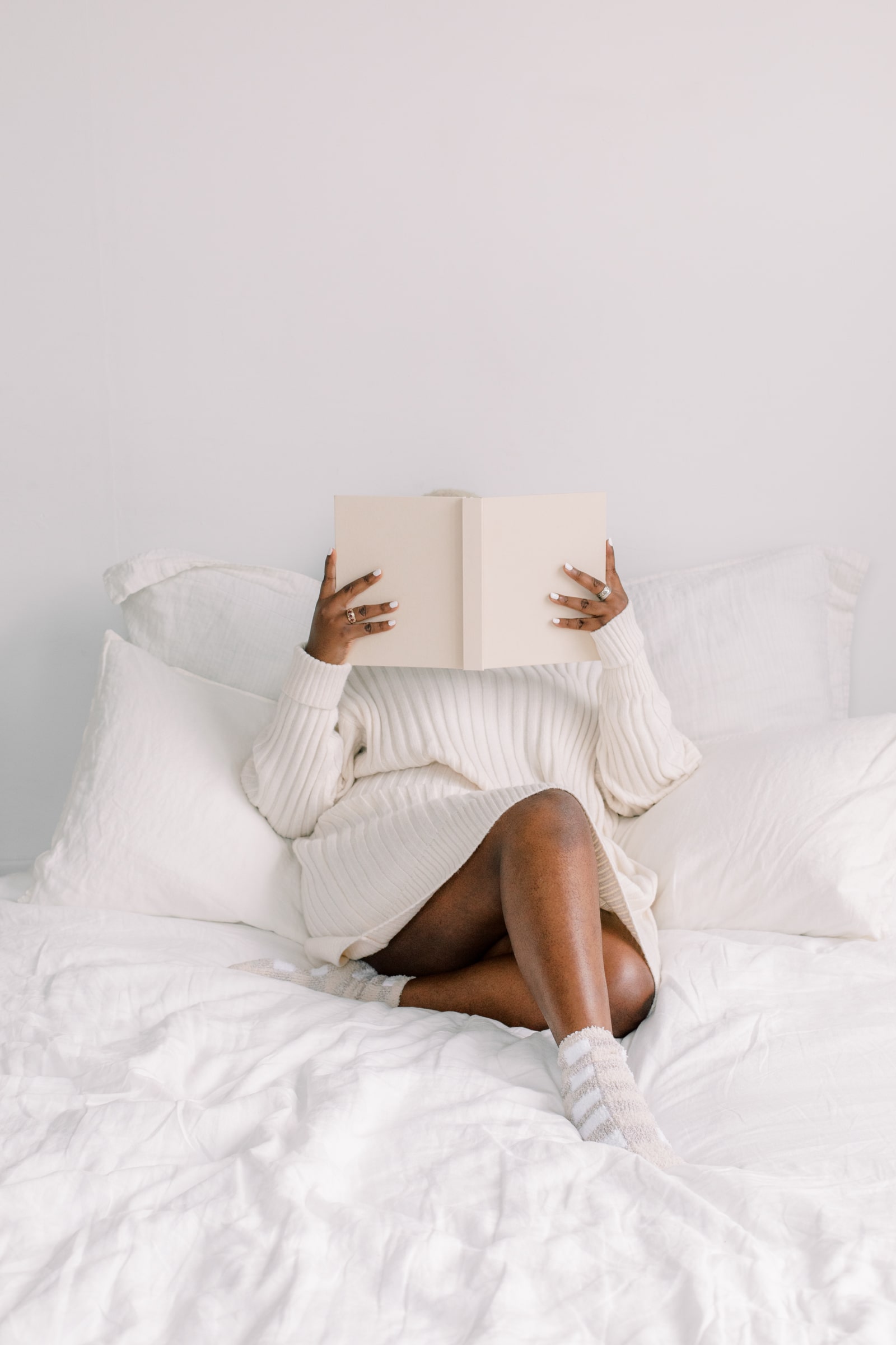 A woman reading in bed.