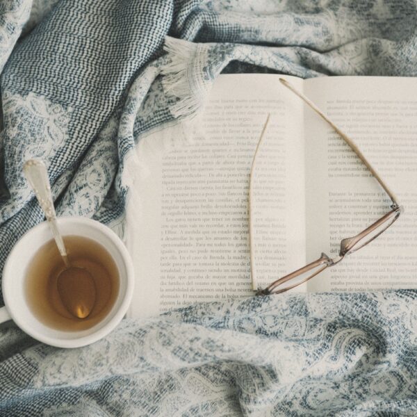 As I sit here at the kitchen table (poem)