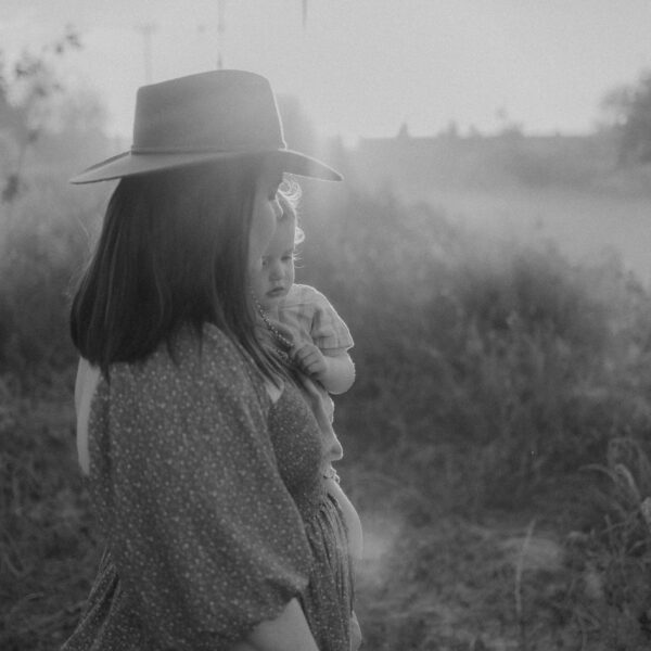 A woman holding her child: Second image for mamas find your voice