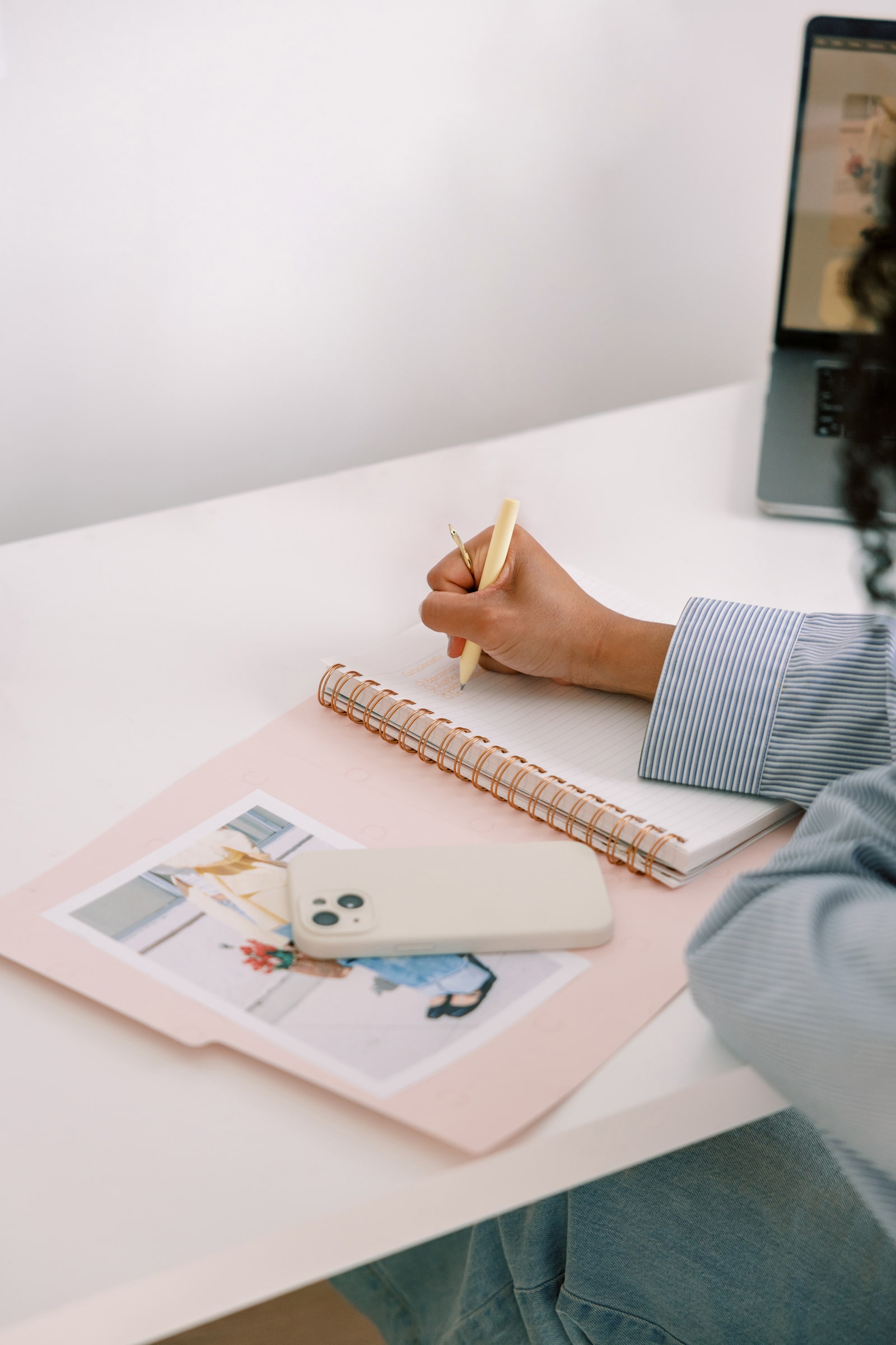 A woman writing on her notepad